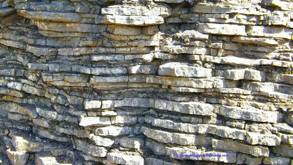 Closeup of well defined rock layers along the road
