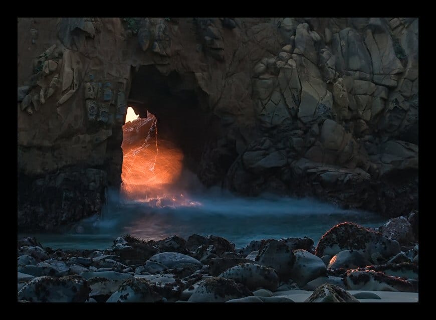 Fire in the Hole! Liquid fire pours through the archway in Keyhole Rock on Pfeiffer Beach in Big Sur