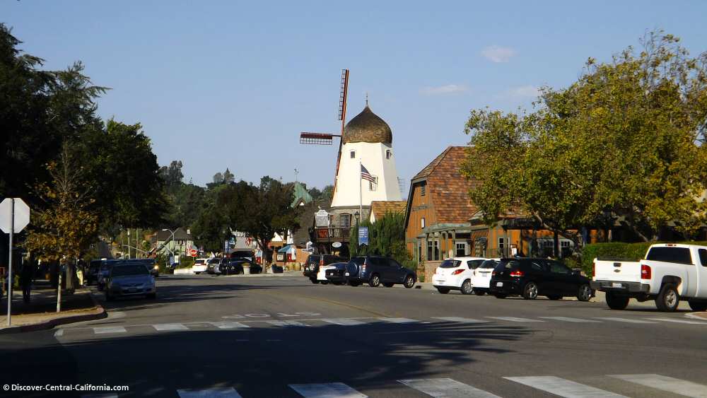 A windmill in the middle of a street.