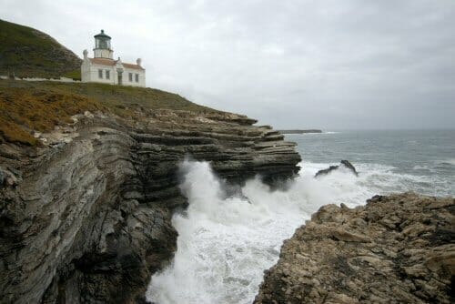 A lighthouse on a cliff.