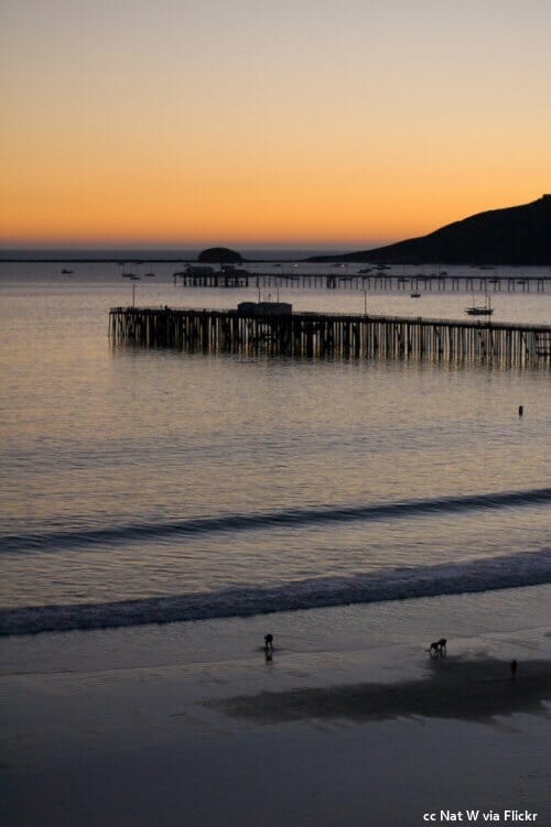 Sunset at Avila Beach with the piers and Whalers Rock in the distance