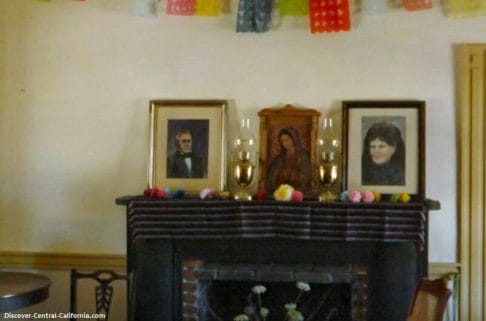 Fireplace in the main salon with portraits of William and Maria Josefa on the mantle
